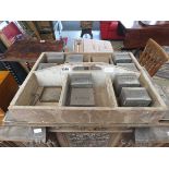 Storage tray with quantity of vintage tin boxes