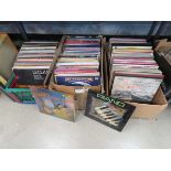 3 boxes containing vinyl records