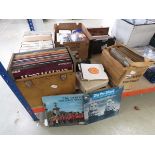 2 boxes and stack of vinyl records