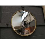 Circular bevelled mirror in gold painted frame