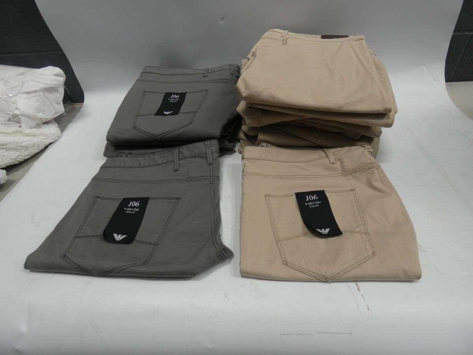 +VAT Bag containing 20 Armani chinos, 7 in light grey and 13 in beige, various sizes ranging from