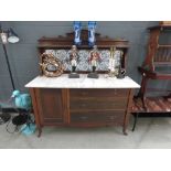 Marble topped washstand with tiled splashback