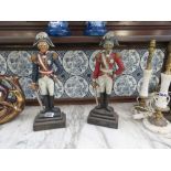 Pair of cast iron doorstops in form of military generals