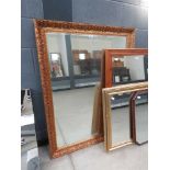 Large rectangular bevelled mirror in decorative gilt frame