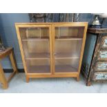 Oak and glazed double door bookcase