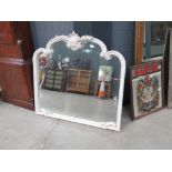 Over mantle in white painted frame
