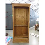 Pine open bookcase with drawer under