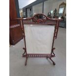 Chinese inspired carved wooden fire screen with fabric panel