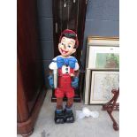 Painted wooden figure of Pinocchio