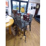 2 similar wrought metal floor standing candleabras