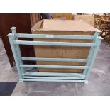 Green painted wooden shoe rack