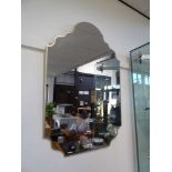 Gilt framed shaped wall mirror