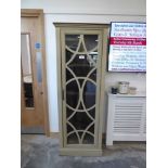 +VAT Tall sage coloured display cabinet with single glass door