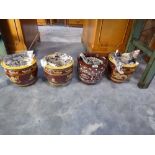 4 graduated sets of brown and yellow decorative planters