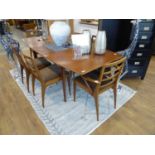 Mid century teak McIntosh extending dining table with 6 matching dining chairs