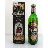 An old bottle of Glenfiddich Pure Malt Scotch Whisky circa 1980's in Clan Maclean tin 40% 75cl