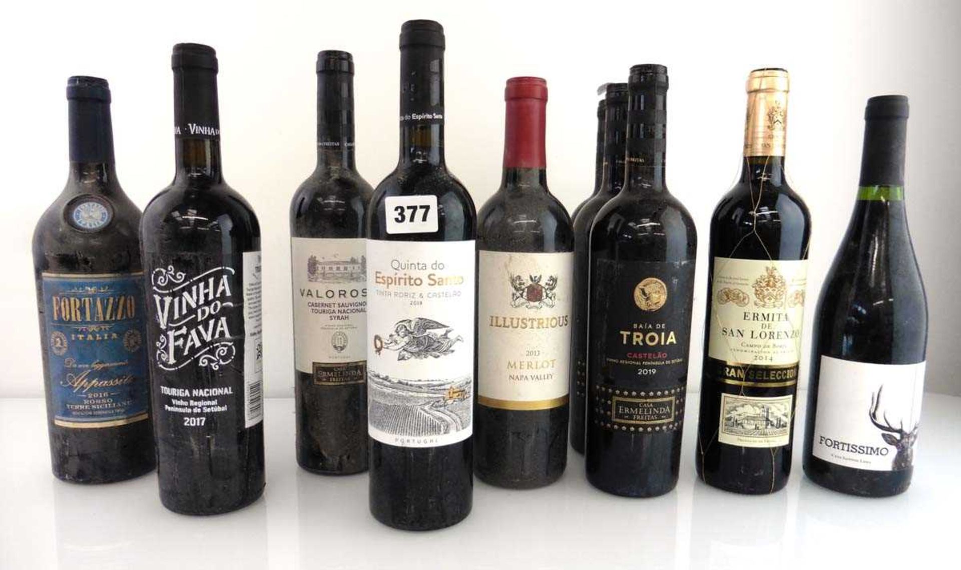 10 bottles, 3x Baia De Troia Castelao 2019 Portugal, 1x Illustrious 2013 Merlot Napa Valley, 1x