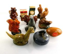 A collection of 13 Beneagles, Beswick and other whisky miniatures in the forms o Animal, Curling