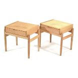 A pair of light oak single-drawer bedside cabinets on tapering supports, w. 49 cm each (2)