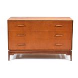 A 1960's British teak chest of three drawers with outswept handles on square feet, w. 107 cm