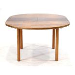 In the manner of Archie Shine and Gordon Russell, a 1960/70's rosewood extending dining table of