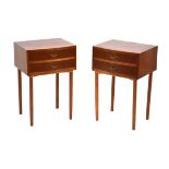 A pair of 1960's teak two-drawer bedside cabinets on later teak legs, w. 43 cm, h. 65 cm (2)