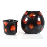 A contemporary Poole Pottery vase decorated with a matt black body and treacle glaze spots, h. 28