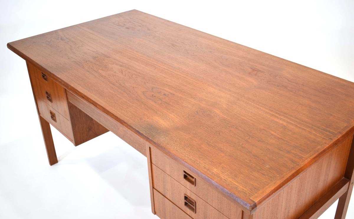 A 1960's Danish teak and crossbanded kneehole desk with an arrangement of seven drawers, the reverse - Image 2 of 5