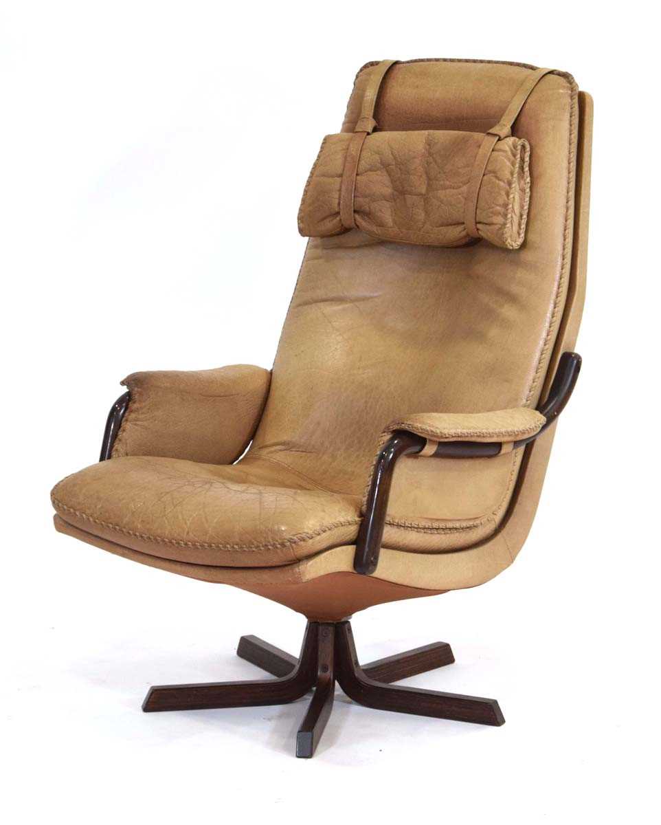 A 1970's Danish reclining high-back armchair by Berg Furniture, the buffalo leather seat with