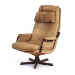 A 1970's Danish reclining high-back armchair by Berg Furniture, the buffalo leather seat with