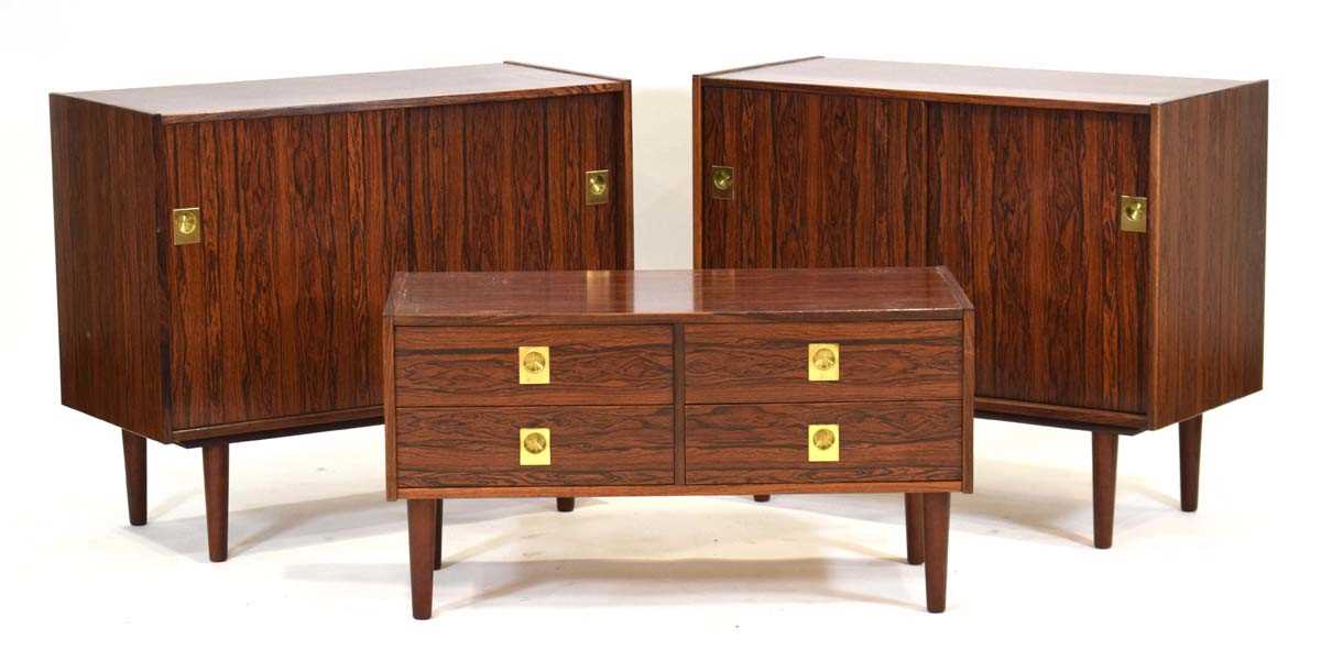 A 1970's Danish suite of cabinets by AEJM Mobler, including a pair of sliding two-door cabinets