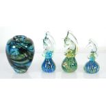 A David Wallace art glass vase, signed, h. 12 cm, together with three Mdina glass paperweights