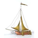 Daniel d'Haeseleer: a copper and brass wall sculpture modelled as a double sailing boat, w. 41 cm,