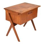 A 1960's Danish teak side table, the frieze drawer enclosing a fitted interior, on inverted Y-shaped