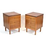 A pair of 1950's three-drawer walnut bedside chests, on later legs, w. 43 cm, h. 63 cm (2)