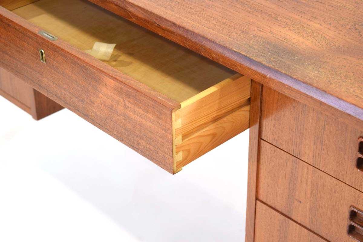 A 1960's Danish teak and crossbanded kneehole desk with an arrangement of seven drawers, the reverse - Image 4 of 5