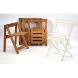 A set of four pine folding chairs in the manner of Aldo Jacober, together with a pair of white