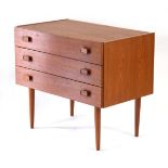 A 1970's and later British teak chest of three drawers, each with square handles, on beech