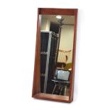 A 1960/70's mirror, the rectangular plate within a sloping frame, 79 x 36 cm