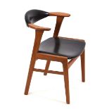 In the manner of Erik Kirkegaard, a Danish teak and black upholstered desk/elbow chair*Sold