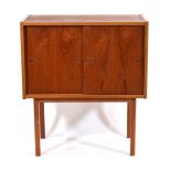 A 1960's Danish teak cabinet with two sliding doors on chamfered legs, w. 80 cmThere are some