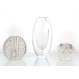An Orrefors clear glass vase, signed and numbered 3668/7, h. 20 cm, together with two further