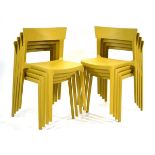 A set of four Italian mustard yellow moulded 'Skin' stacking chairs by Calligaris (4)Image shows 143