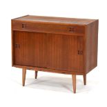 A 1960/70's Swedish teak cabinet with a single drawer, pair of sliding doors and integral moulded