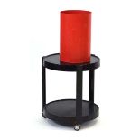 G. Colombini for Kartell, a red plastic receptacle, h. 38 cm, together with a black-two tier trolley