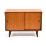 A 1970's and later Danish teak cabinet with two sliding doors and partially fitted interior, on