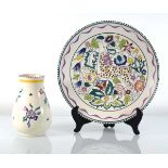 Carolyn Beckwith for Poole Pottery, a hand-painted charger decorated with a deer amidst foliage,
