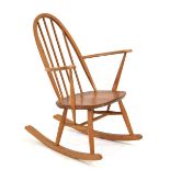 An Ercol elm-seated rocking chair with a beech spindle backAppears to be solid. No obvious signs