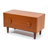 A 1970'S and later teak two-drawer chest on turned legs, w. 80 cm