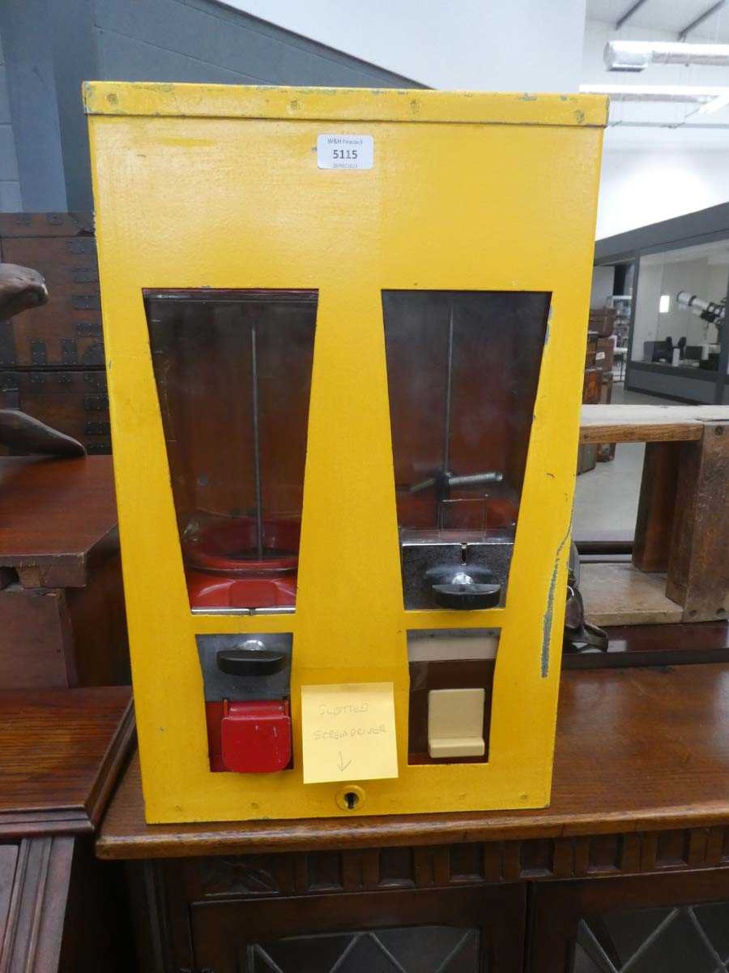 A vintage yellow Bubble-gum or sweet dispenser machine, h. 57 cm